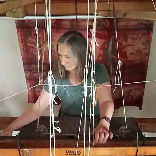 Weaver working at her loom at home in Kilcar, County Donegal.